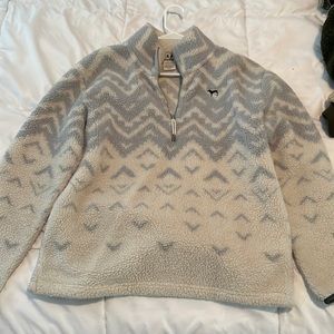 Blue and white pattern, fleece, teddy pullover with zipper and two pockets.